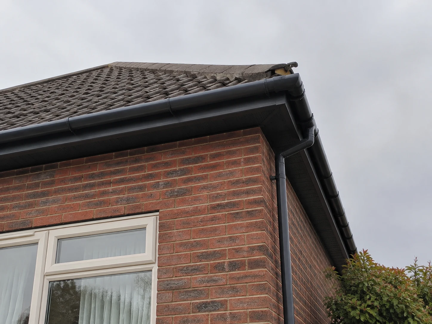Example house roofline with guttering and fascia boards.